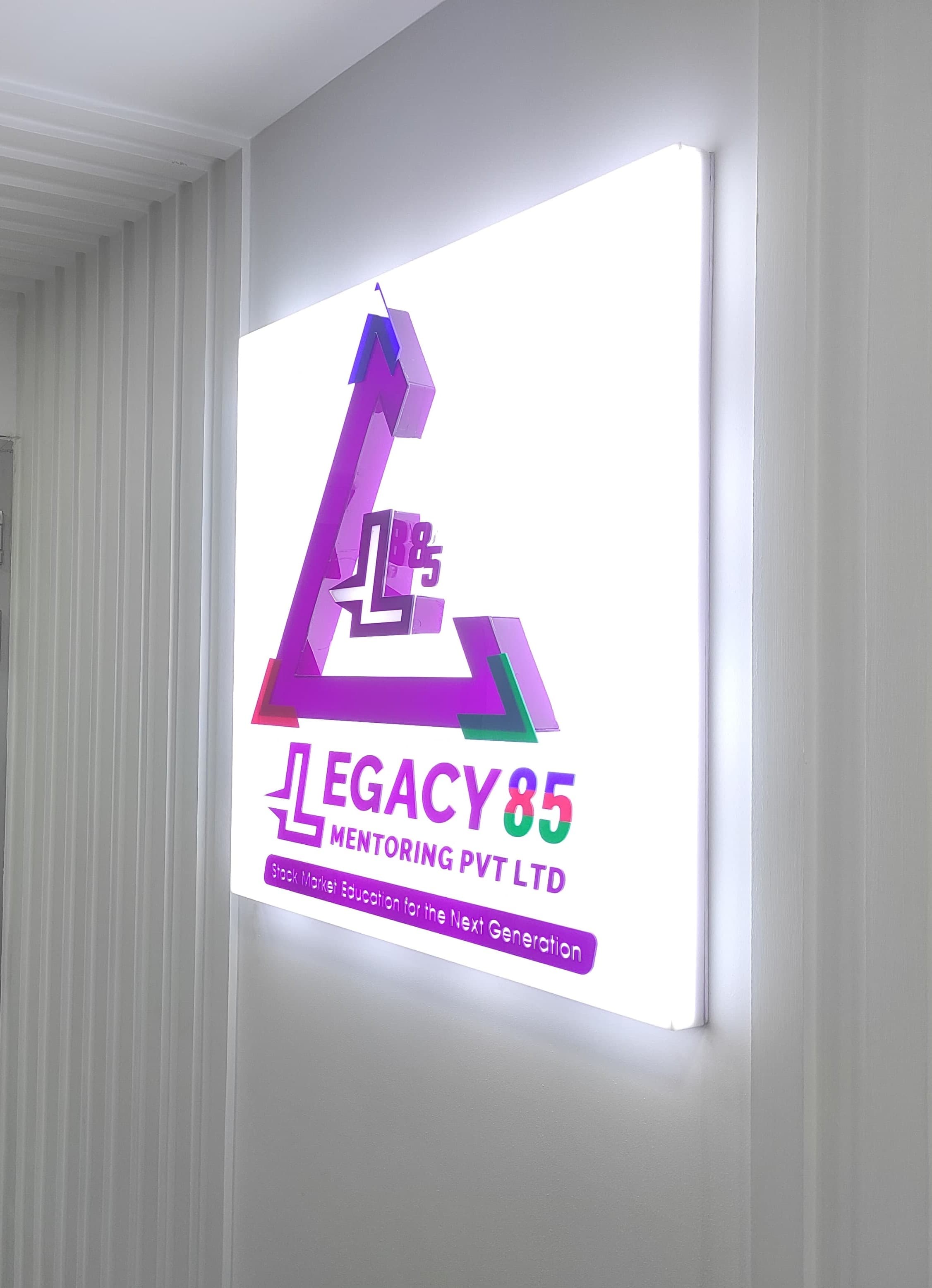 Close-up of a student analyzing stock charts at Legacy85.